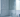 Water beading on a glass shower screen in a bright bathroom, with cloudy limescale visible along the untreated edge