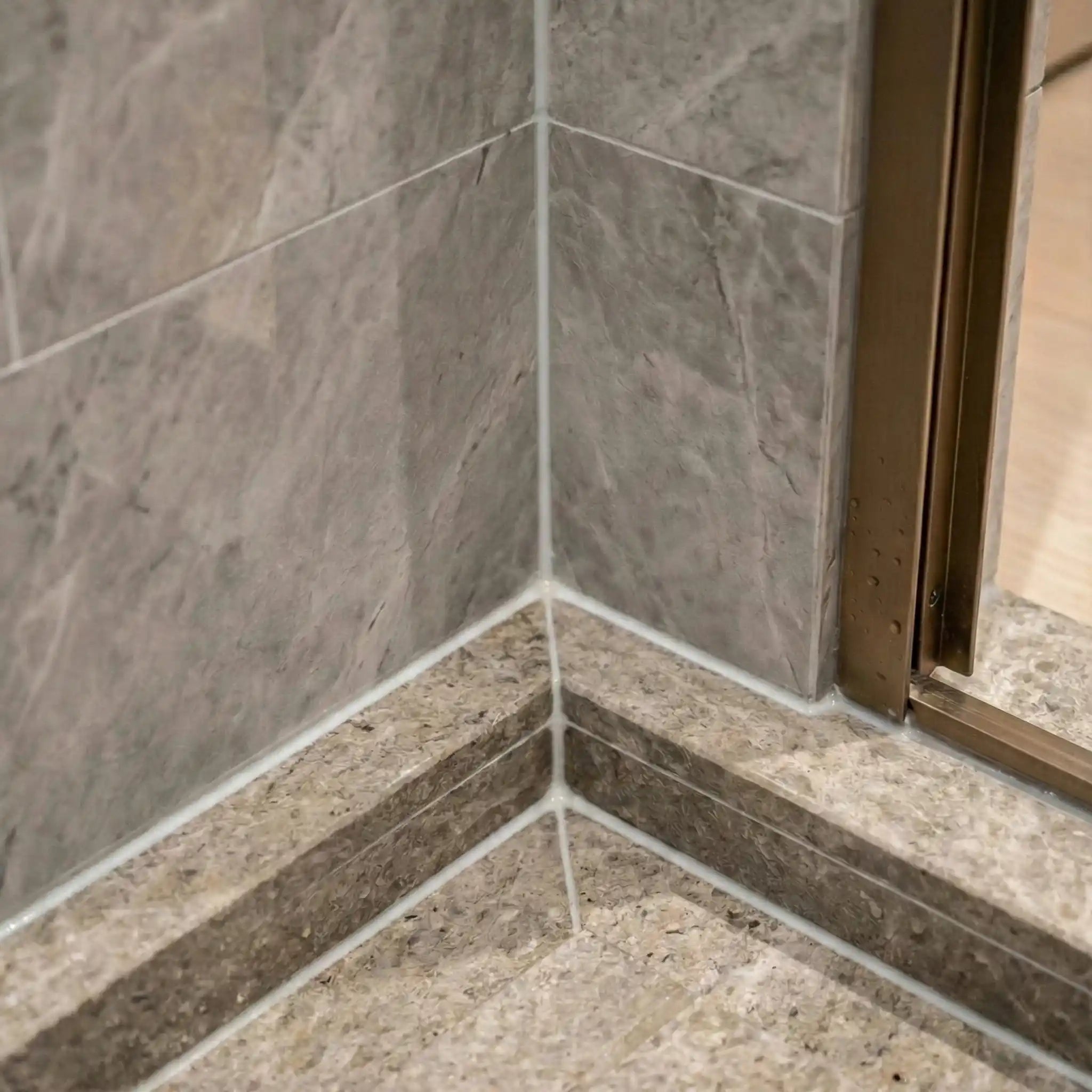 Clean, mould-free bathroom grout and corners, after applying Nordic Freezz antimicrobial coating
