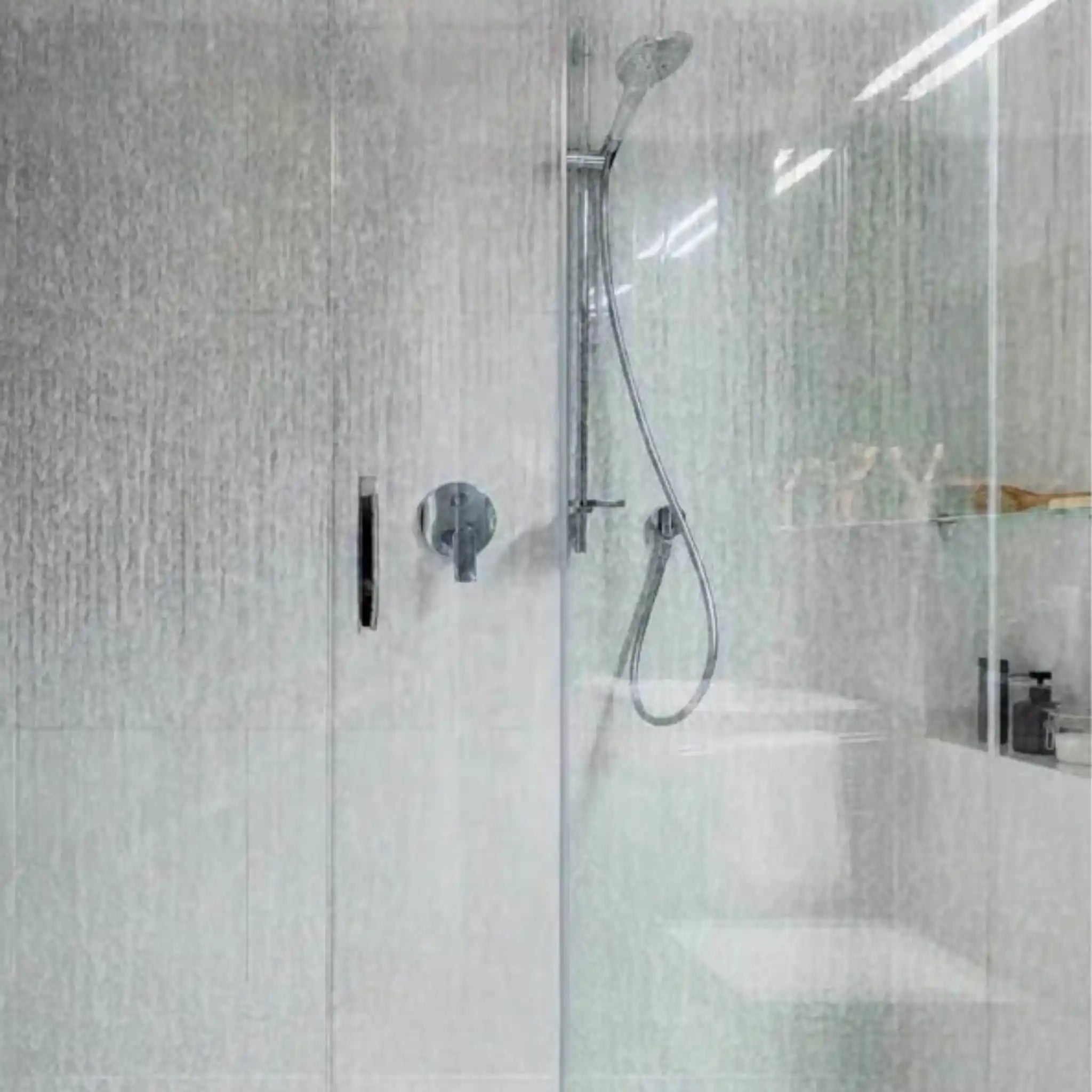 hower screen covered in hard water spots and limescale, before Nordic Freezz treatment